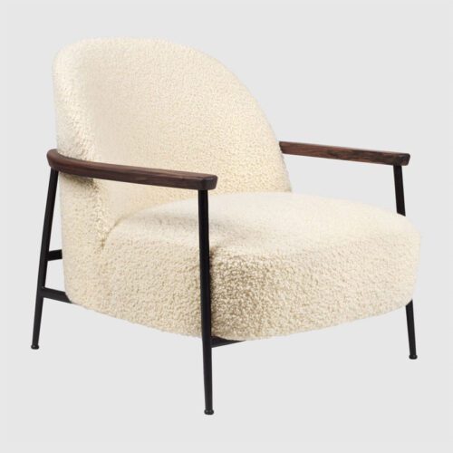 Gubi Sejour Lounge Chair with walnut armrest sheepskin base Black Matt
