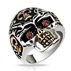 Skullring med rød sten.